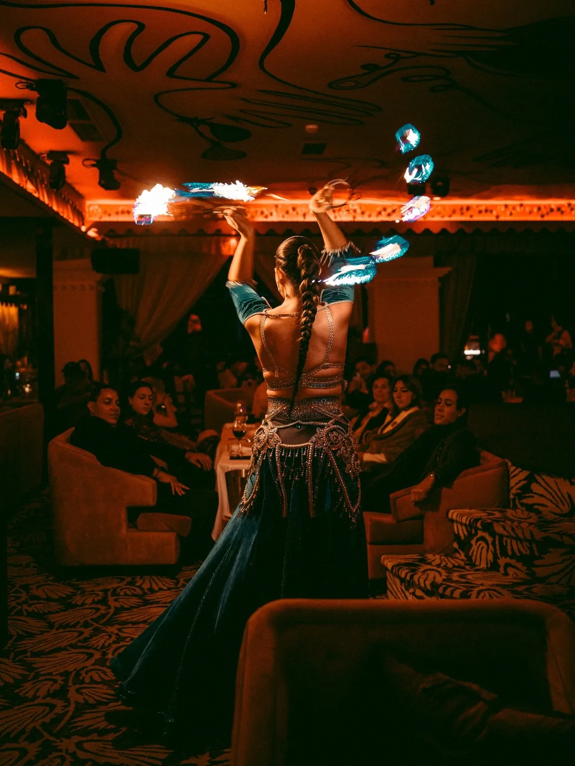 A fire performer among the tables at Coup de Foudre